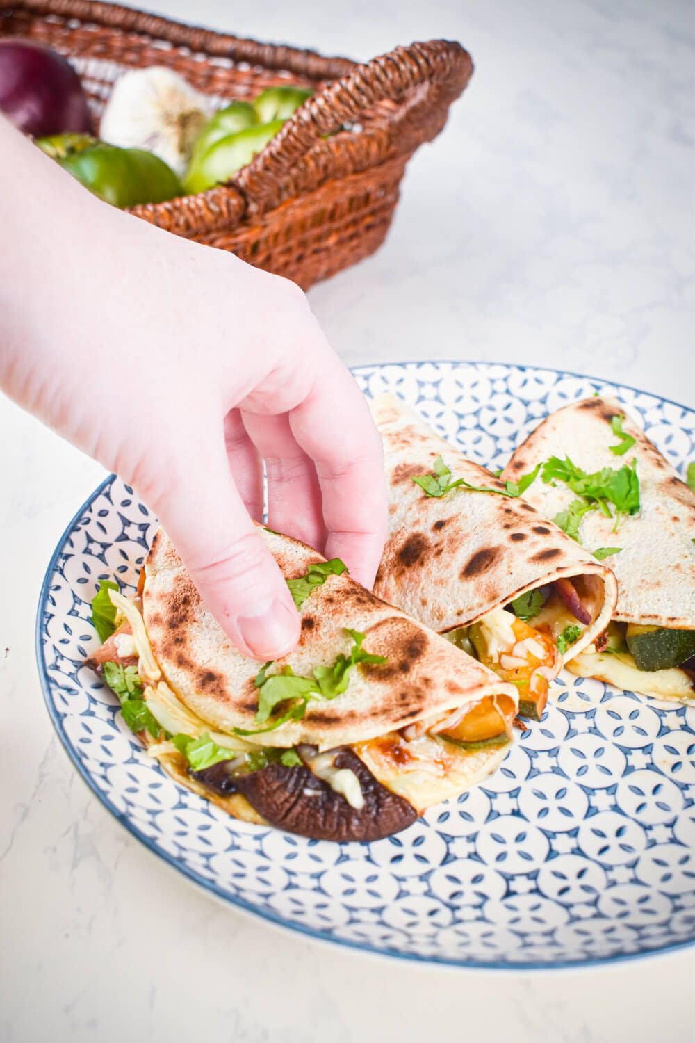 Mushroom quesadillas with portobellows, zucchini, onions, cheese, and cilantro in a flour tortilla.