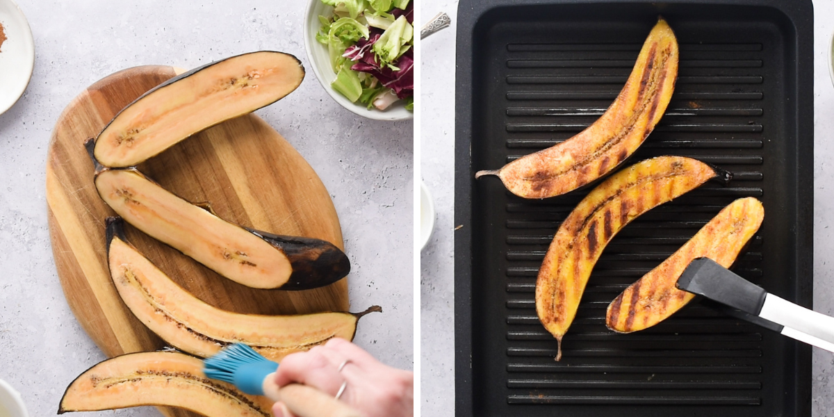 Ripened plantains being brushed with oil before grilling on a ridged pan, alongside a bowl of salad and spices on a wooden board.