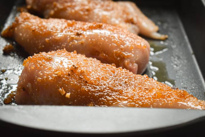 Chicken breasts cooking in the oven. 