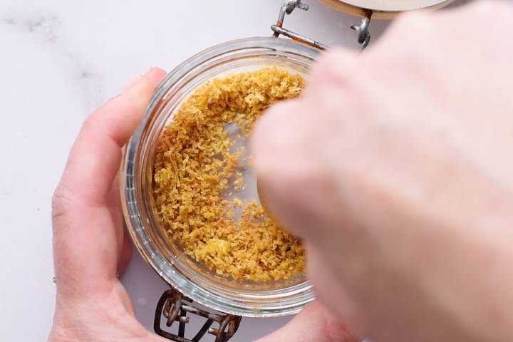 Lemon zest being chopped into smaller pieces.
