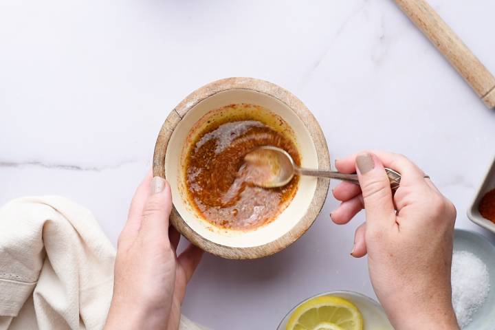Butter, lemon juice, lemon pepper seasoning, and paprika in a small bowl.