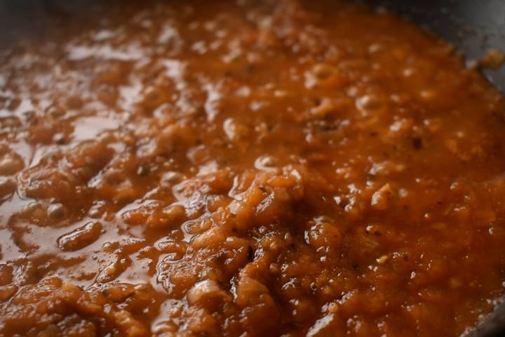Sofritas tomato sauce simmering in a skillet.