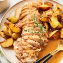 Instant pot turkey tenderloin with potatoes and gravy on a plate.