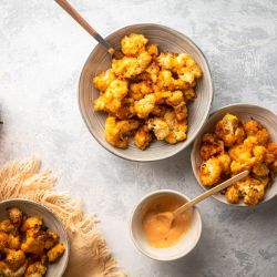 Bang bang cauliflower baked with breadcrumbs and tossed in a sweet and spicy orange sauce.
